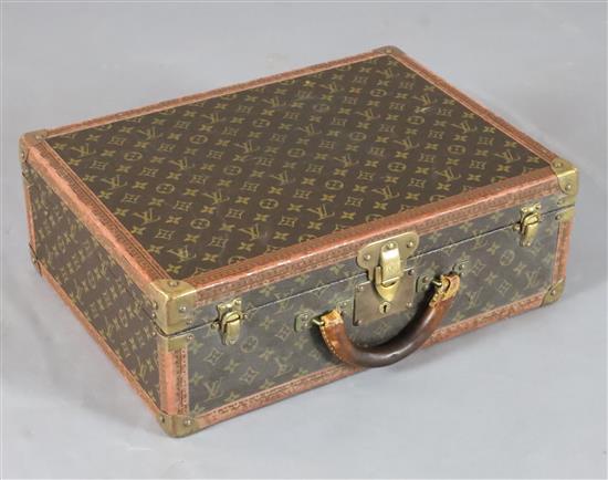 A Louis Vuitton suitcase, 20 x 14.5 x 7in.